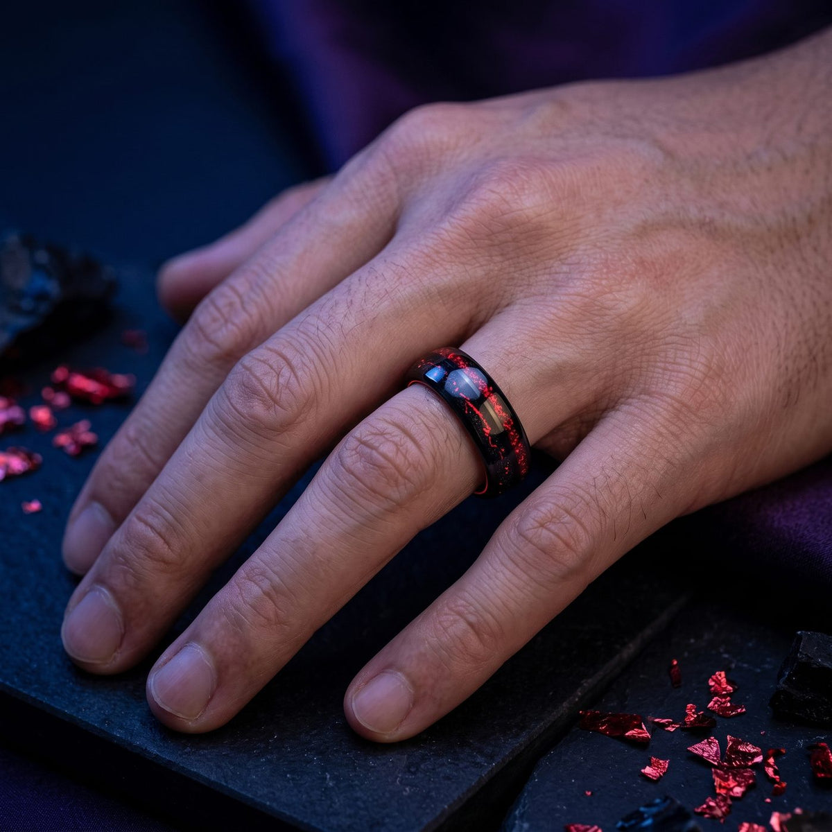 Men's red and black tungsten ring worn on hand