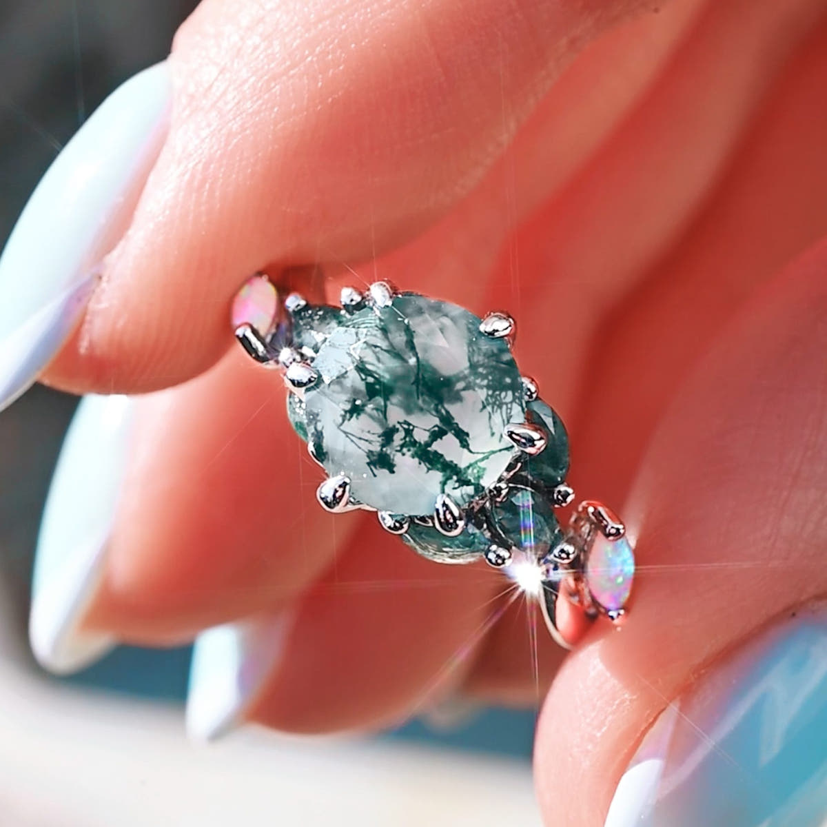 Moss agate center stone seen from above, close-up of the sterling silver ring