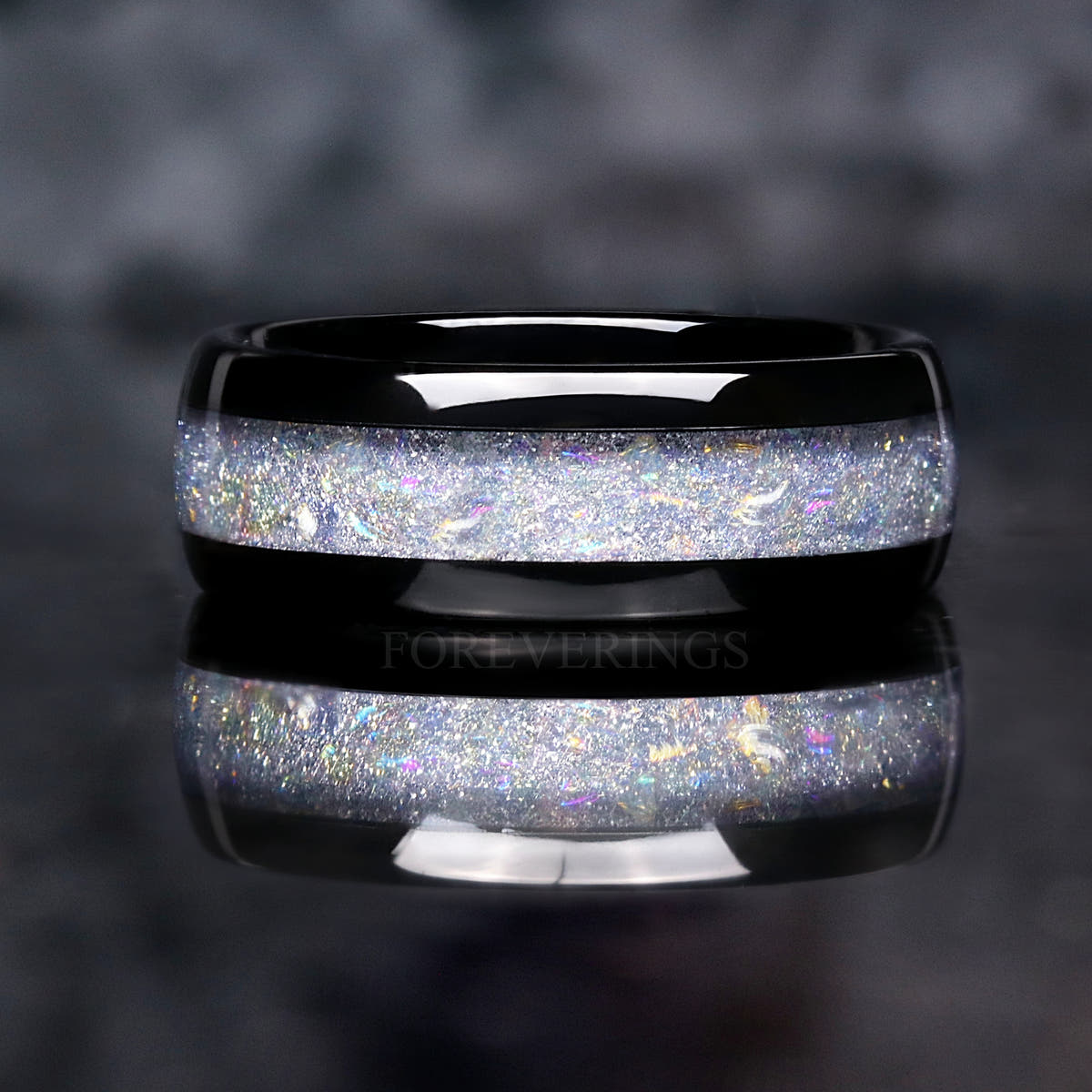 8mm black tungsten moonstone ring shown straight on, reflection below