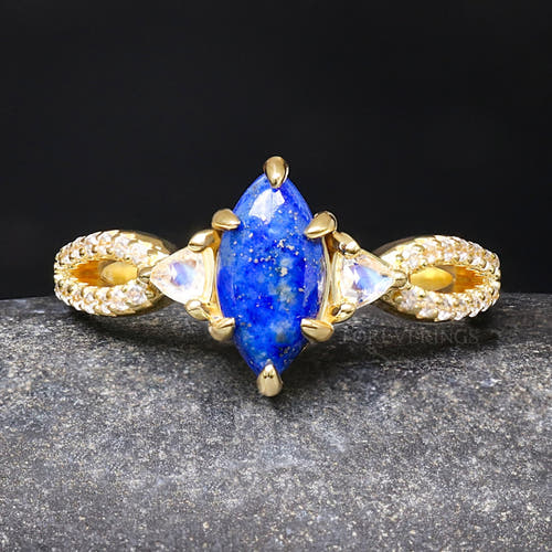 Women's gold sterling silver engagement ring with a marquise lapis lazuli and moonstone side stones