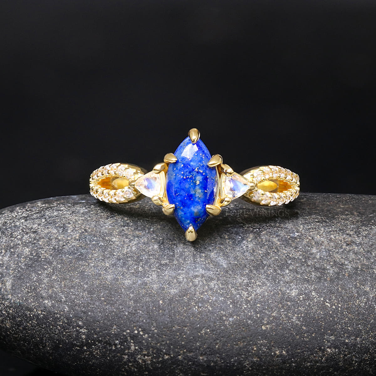 Lapis lazuli engagement ring in gold sterling silver shown straight on, with its twisted band