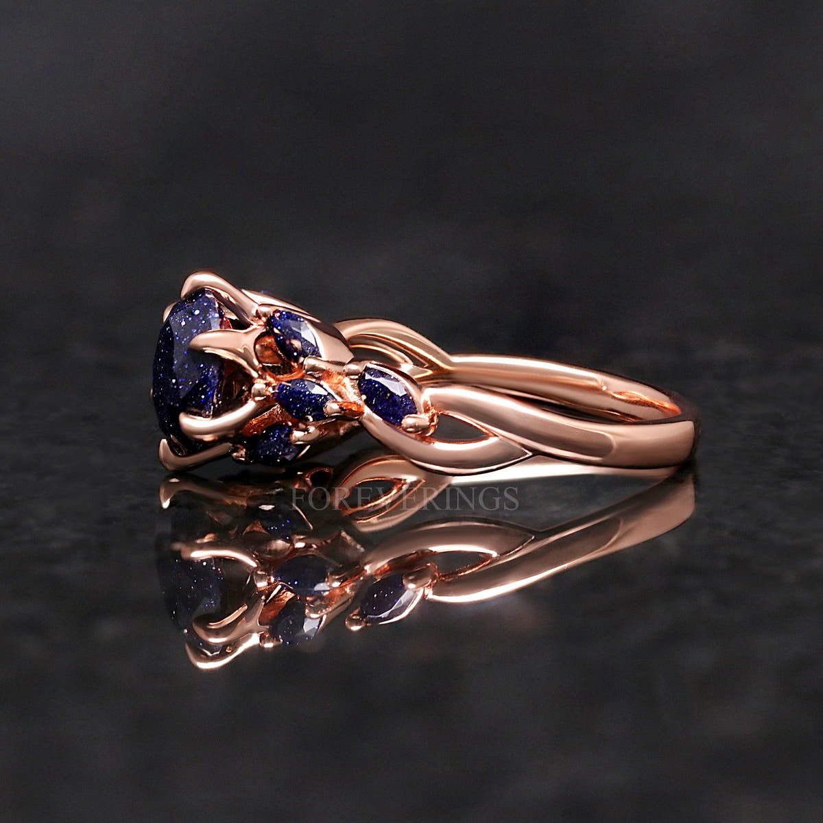 Side profile of the blue sandstone ring showing the twisted rose gold band