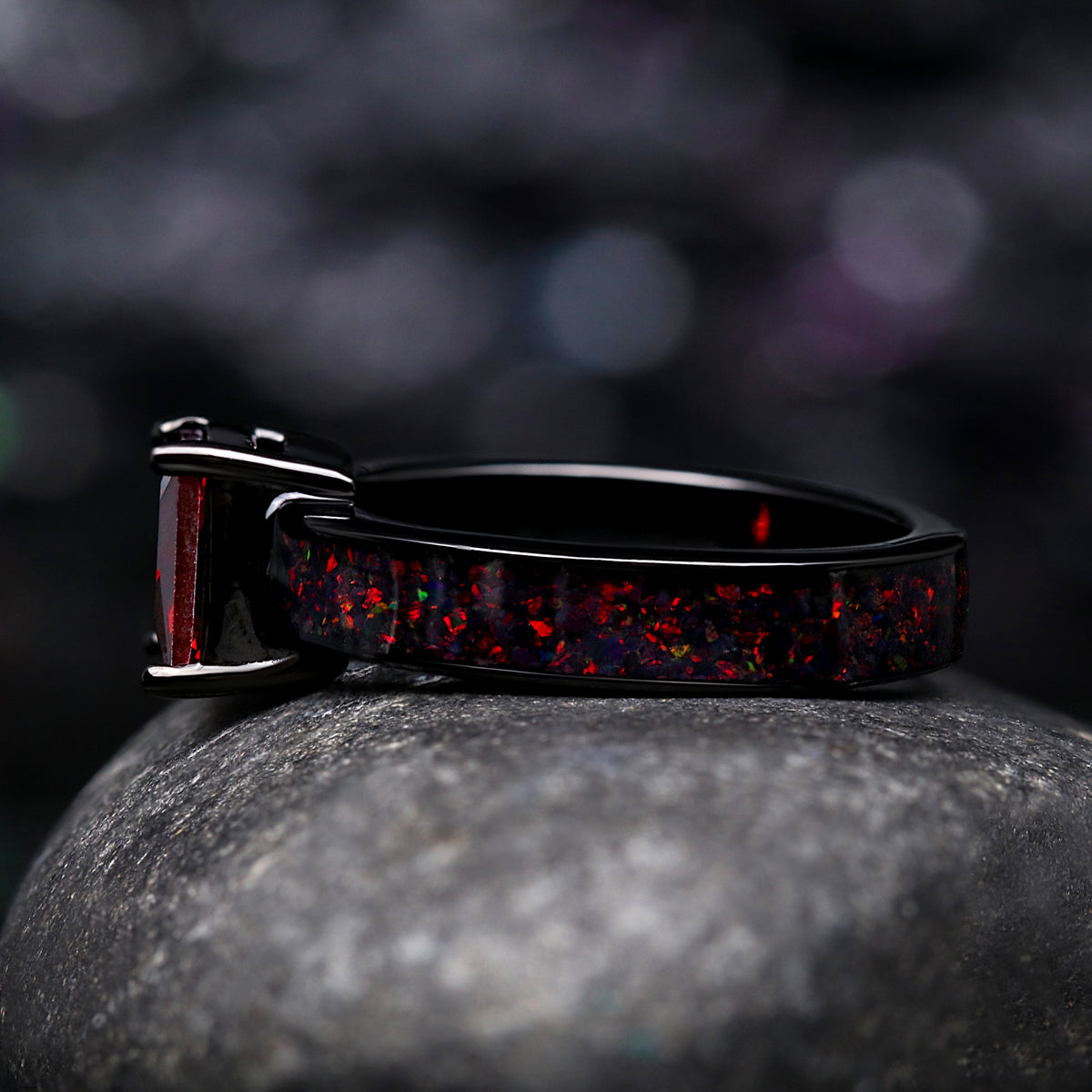 Matching his and her black wedding bands with gemstones