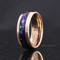 Men's 8mm rose gold tungsten band with blue Orion nebula sandstone inlay, angled to show the interior