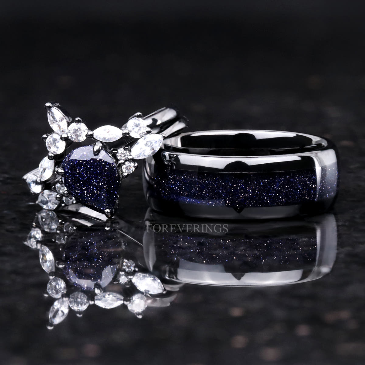 Black sterling silver sandstone bridal set beside a wide black band with blue sandstone inlay