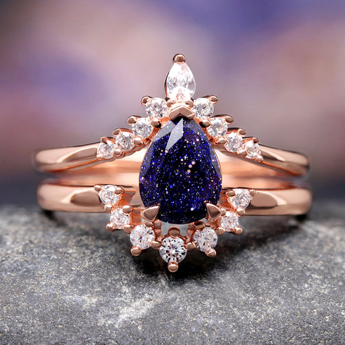 Rose gold sterling silver bridal set with a pear cut blue sandstone and crown-style band