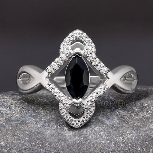 Women's sterling silver Celtic engagement ring with a marquise black center stone, close top view