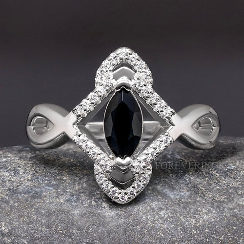 Women's sterling silver Celtic engagement ring with a marquise black center stone, close top view