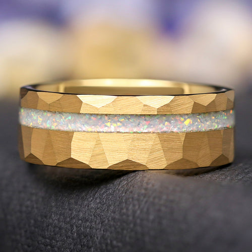 Men's hammered gold tungsten ring with white fire opal inlay, shown straight on