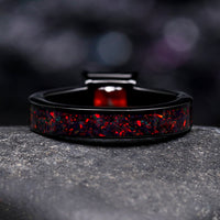 Couples engagement and wedding rings with black fire opal