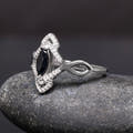 Marquise black stone ring in sterling silver, angled side view showing the twisted band
