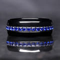 Men's 8mm black tungsten band with a channel of blue sapphire stones, straight-on view