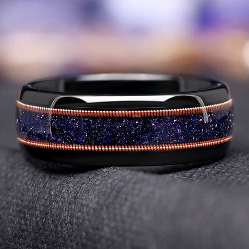 Men's 8mm black tungsten band with blue sandstone and rose gold guitar string inlay, close-up