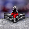 Women's kite-cut garnet engagement ring and curved band in black sterling silver, white accent stones
