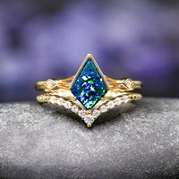 Matching Celtic wedding bands with emerald opal for couples