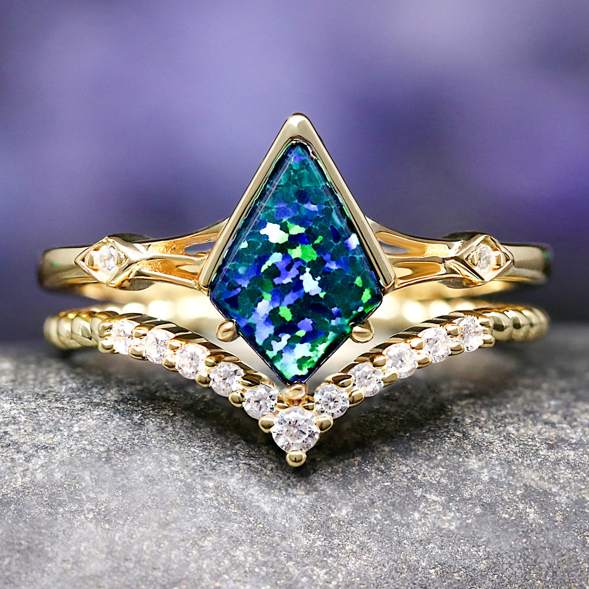 Gold engagement ring with a green emerald opal.