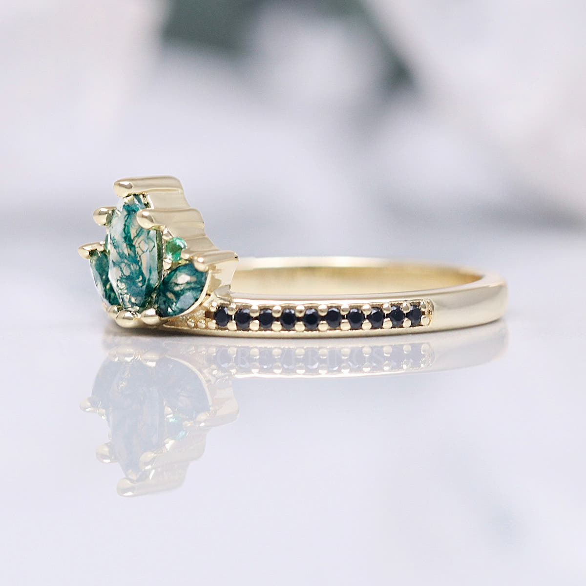 Moss agate lotus ring in gold sterling silver, side view of the crown setting
