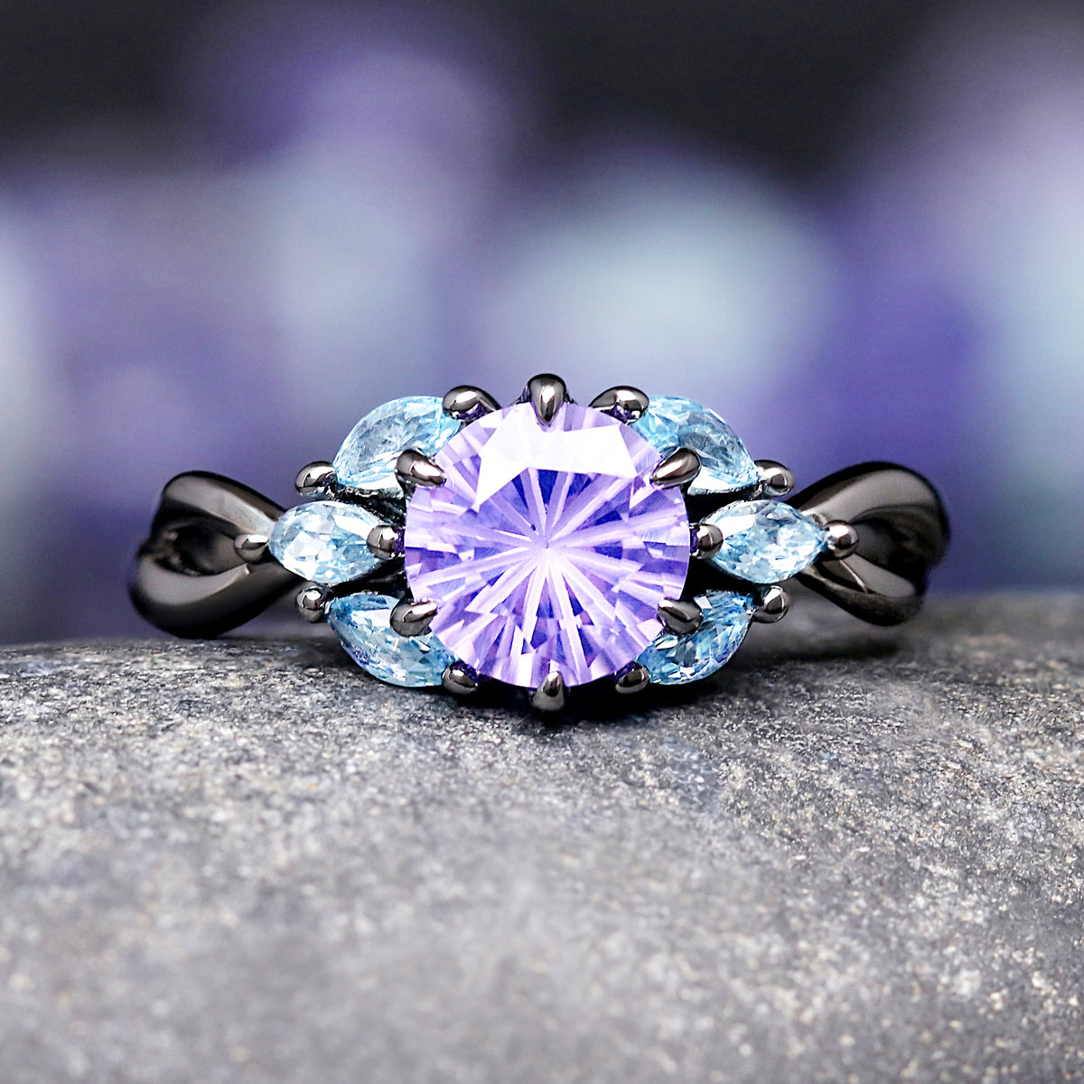 Black sterling silver promise ring with purple and blue gemstones