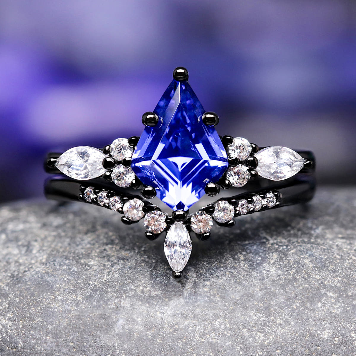 Women's black sterling silver kite-cut sapphire bridal set with marquise accents, front view