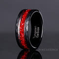 Men's 8mm black faceted tungsten band with crushed garnet inlay, angled to show the interior