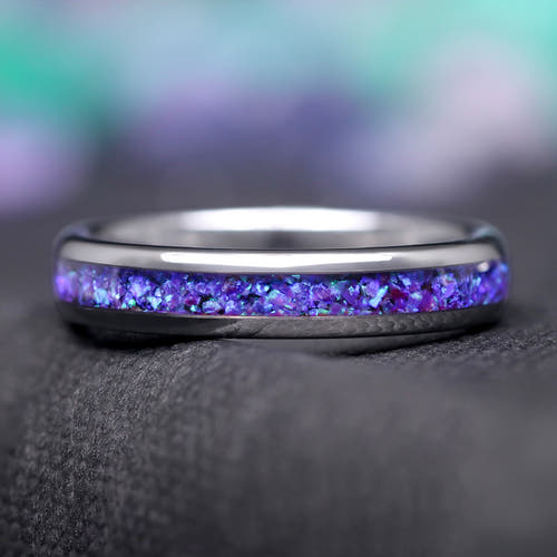 4mm silver tungsten ring with blue aurora opal inlay, lying flat in a front view