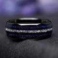 Men's 8mm black tungsten ring with a crushed moonstone stripe between blue sandstone stripes