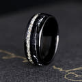 Men's 8mm black tungsten band with crushed diamond and silver flake inlay, standing on edge