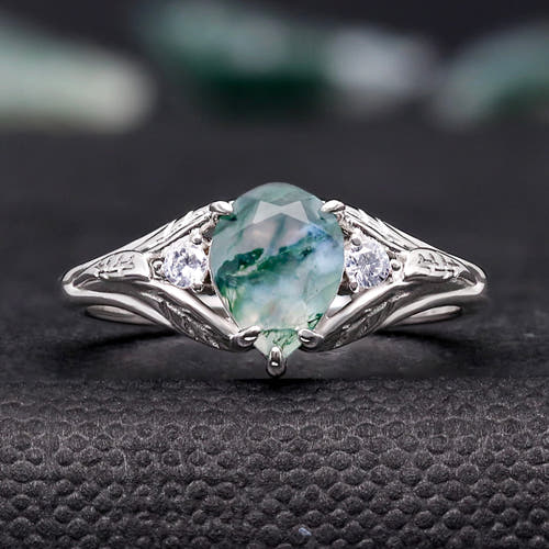 Women's sterling silver pear-cut moss agate promise ring with leaf details, straight on