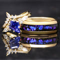 Matching gold couples ring set with kite-cut sapphire engagement ring and Orion nebula inlay band