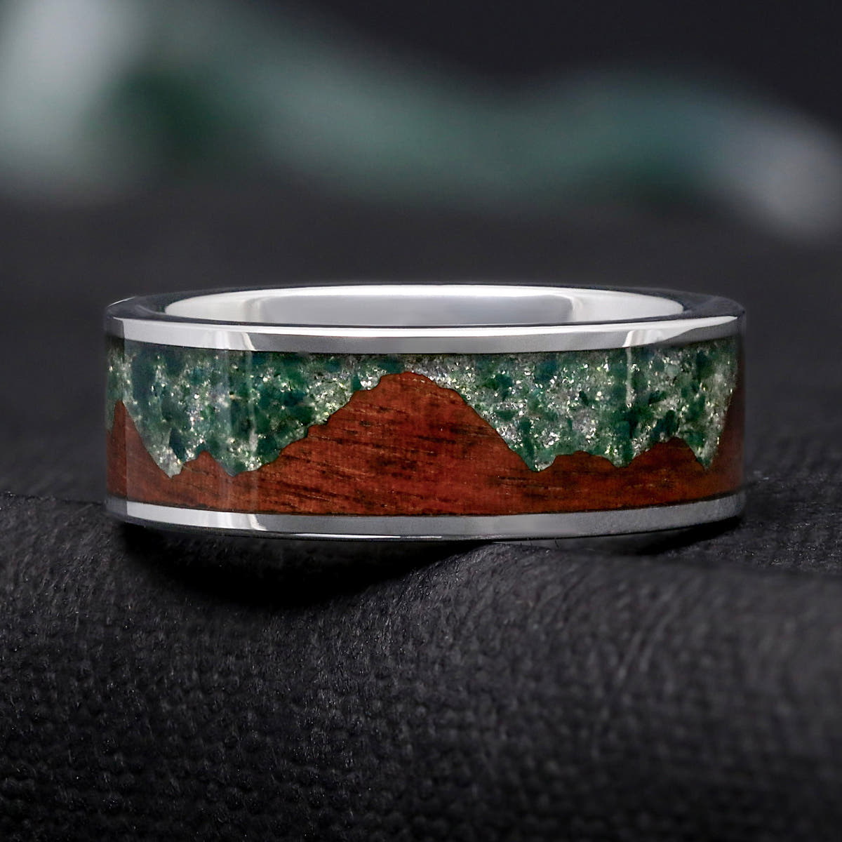 Men's 8mm silver tungsten ring with a moss agate and koa wood mountain inlay, shown straight on
