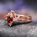 Rose gold black opal engagement ring and curved band, angled side view