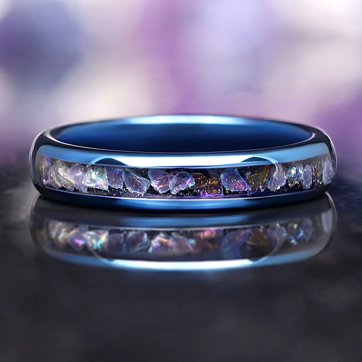 Moonstone tungsten wedding band with blue finish and glowing inlay, inspired by the Veil Nebula