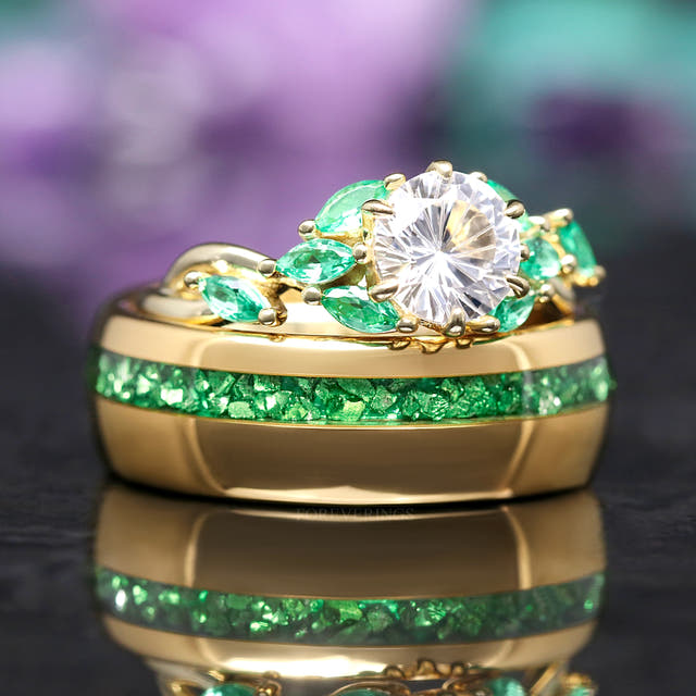 His and hers wedding ring set, white sapphire engagement ring resting on the gold tungsten band