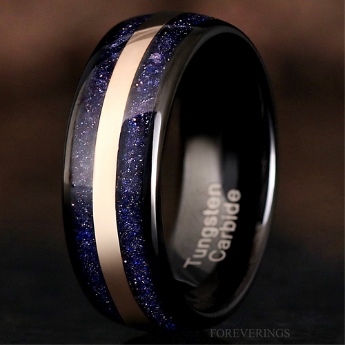 Men's 8mm black tungsten band with Great Rift nebula blue sandstone inlay and a rose gold center stripe