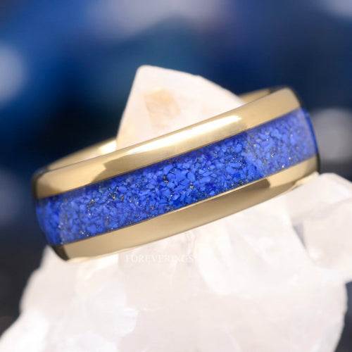 Men's 8mm gold tungsten wedding band with crushed lapis lazuli inlay, close-up