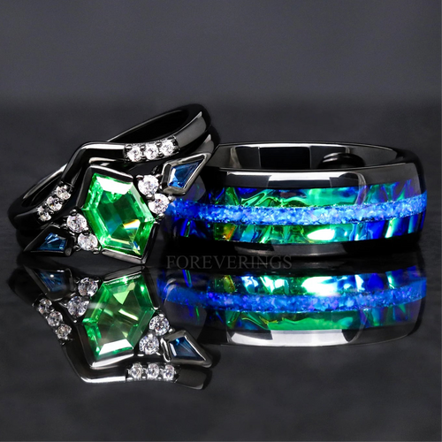 Matching black couples ring set with a tsavorite engagement ring and blue fire opal inlay band