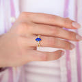 Marquise lapis lazuli engagement ring in gold sterling silver worn on a woman's hand