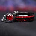 Matching black couples ring set: crescent moon rhodolite ring leaning on an 8mm tungsten band with ruby inlay
