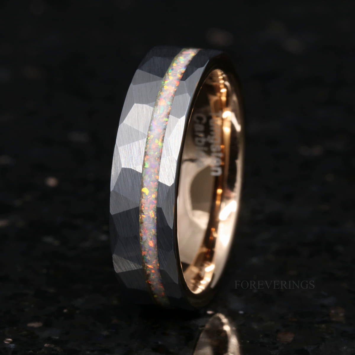 Men's 6mm hammered silver tungsten band with a white fire opal stripe and rose gold interior