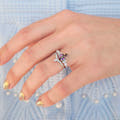 Mystic topaz engagement ring in sterling silver, worn on a hand