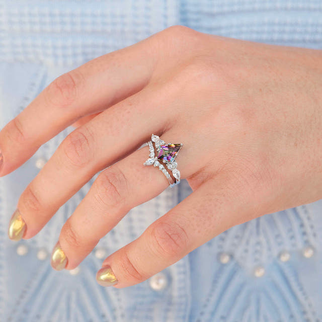 Mystic topaz engagement ring in sterling silver, worn on a hand