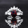 Women's sterling silver bridal set with an oval black fire opal and a crown of clear stones, front view
