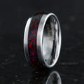 Men's silver tungsten band with black fire opal inlay standing on edge, interior visible