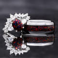 Couples ring set: black fire opal bridal set beside a wider silver tungsten band with the same opal inlay