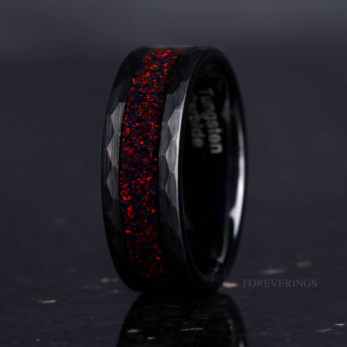 Crushed black fire opal hammered black tungsten band, angled view