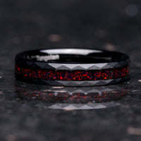 Crushed black fire opal hammered black tungsten band on black background