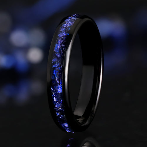 4mm black tungsten ring with a crushed blue sapphire inlay, standing at an angle