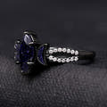 Side view of the black marquise blue sandstone ring and its split shank