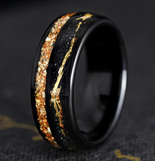 Men's 8mm black tungsten ring with crushed citrine inlay and a gold accent line, angled view