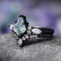 Women's black sterling silver moss agate bridal set with curved band, angled side view